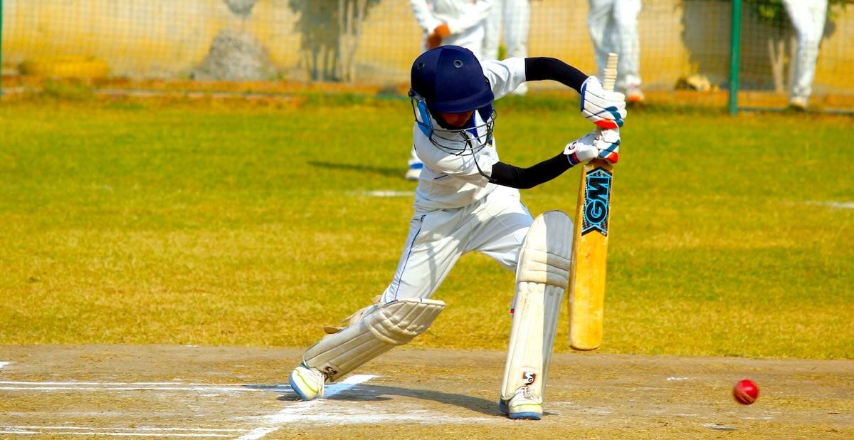 A child playing cricket